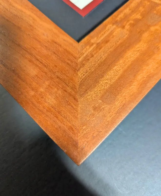 Custom eucalyptus wood frame with Widespread Red mat accent, detail view